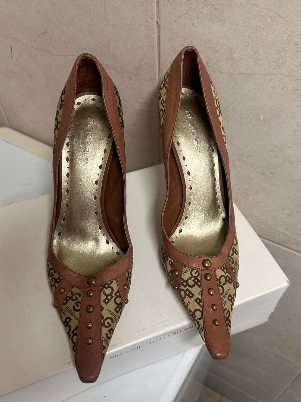 BCBGirls Brown Monogram Pointed-Toe Studded Pumps